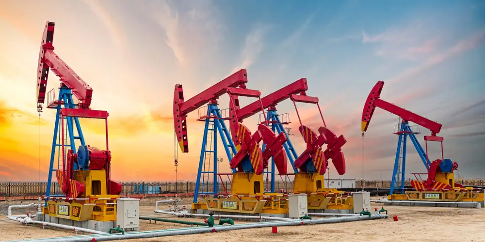 Oil field pump jacks at sunset
